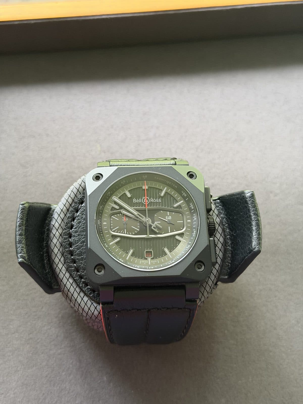Bell & Ross BR 03-94 Blacktrack on its presentation cushion inside the box