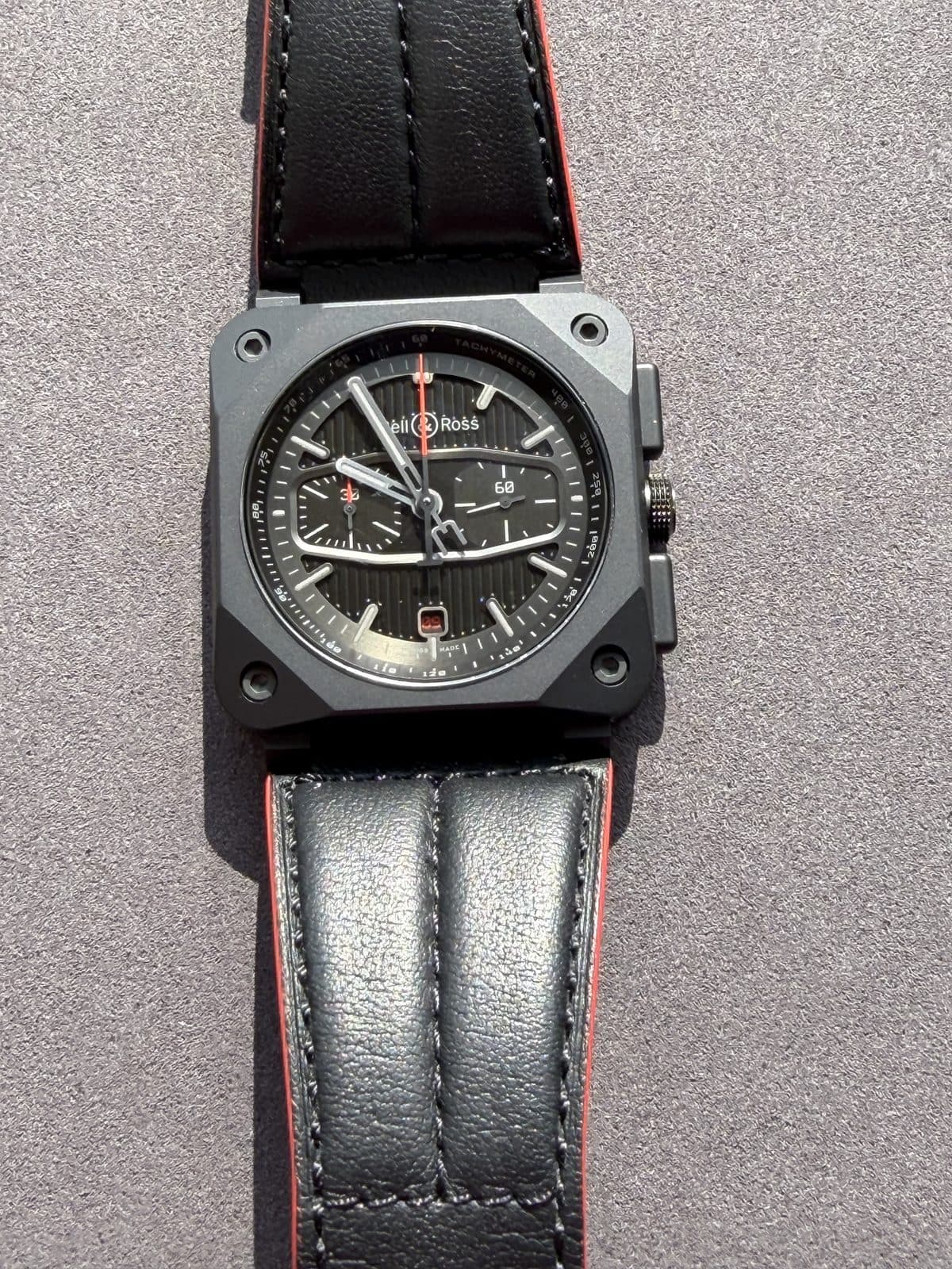 Bell & Ross BR 03-94 Blacktrack dial close-up showing chronograph registers and red accents