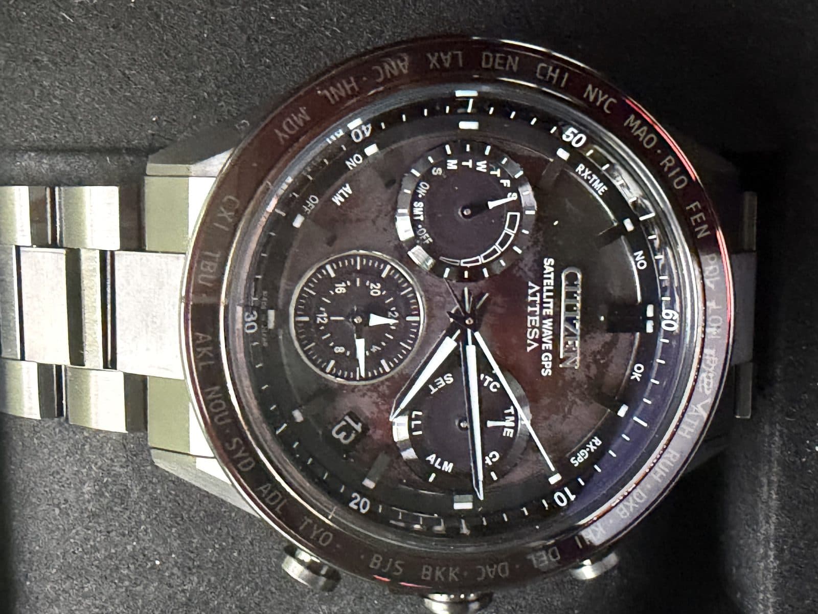 Citizen Attesa Shades of Red CC4077-71Z front view on the titanium bracelet